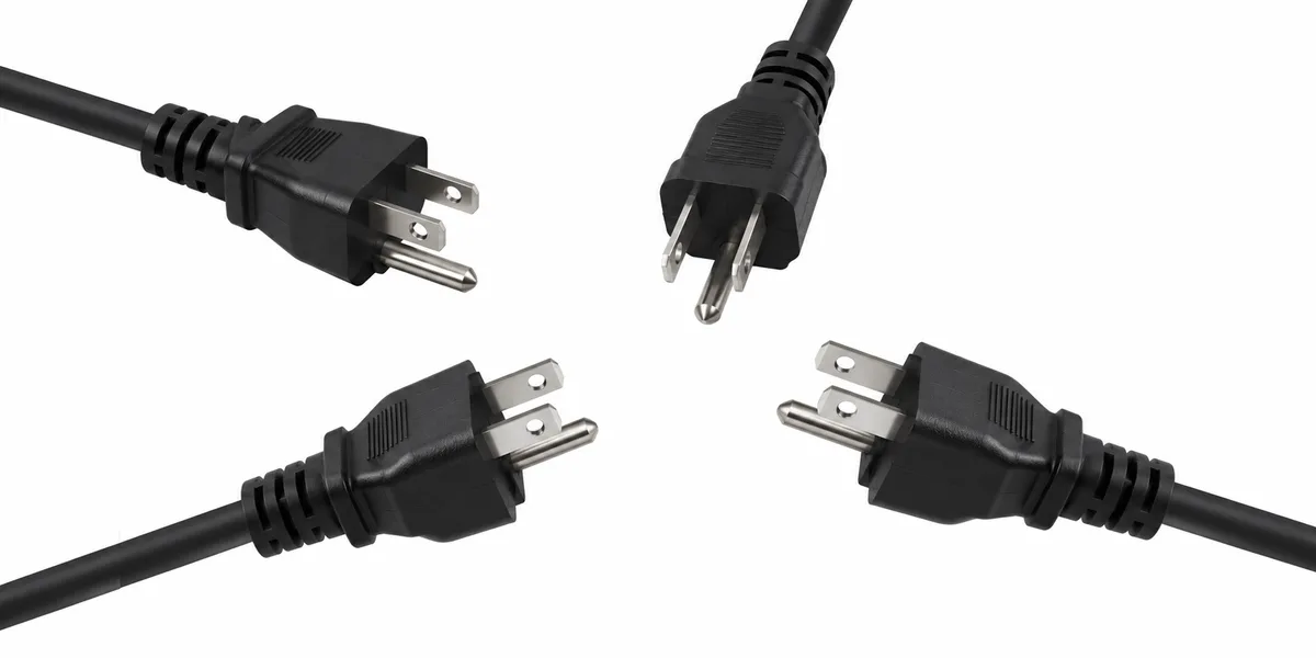 Four three-prong North American power plugs